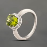 Pre-Owned Platinum 3.01ct Peridot and 0.28ct Diamond Oval Cluster Ring 43541005