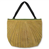 Straw bales of wheat lying on harvested field Designer Tote bag - Yellow