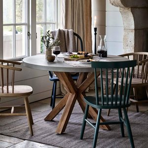 View Burford outdoor round dining table 120cm in grey faux concreate
