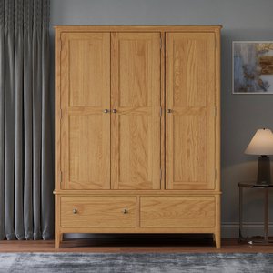 View Solid oak triple wardrobe with hanging & shelves View Solid oak triple wardrobe with hanging & shelves