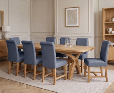 Photo of extending olympia 180cm solid oak dining table with 8 blue braced chairs