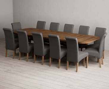 View Extending olympia 180cm rustic solid oak dining table with 12 charcoal grey scroll back chairs View Extending olympia 180cm rustic solid oak dining table with 12 charcoal grey scroll back chairs