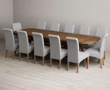 View Extending olympia 180cm rustic solid oak dining table with 12 grey scroll back chairs View Extending olympia 180cm rustic solid oak dining table with 12 grey scroll back chairs