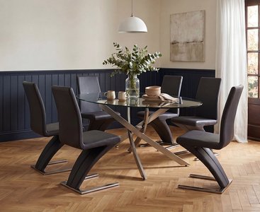 View Bernini 165cm oval chrome leg glass dining table with 6 black aldo chairs View Bernini 165cm oval chrome leg glass dining table with 6 black aldo chairs