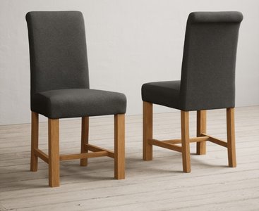 Photo of extending hertford 100cm - 130cm oak and light grey painted pedestal dining table with 4 charcoal grey braced chairs