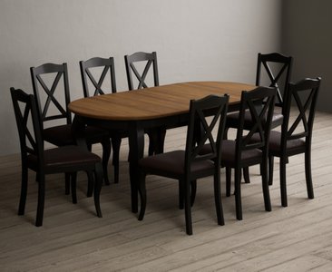 View Extending chateau noir 140cm oak and black painted oval dining table with 8 brown chateau noir chairs View Extending chateau noir 140cm oak and black painted oval dining table with 8 brown chateau noir chairs