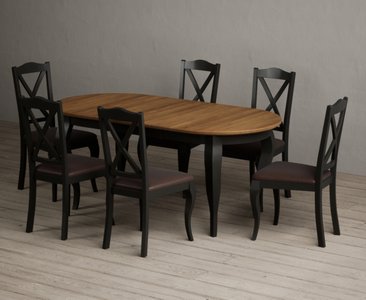 View Extending chateau noir 140cm oak and black painted oval dining table with 6 brown chateau noir chairs View Extending chateau noir 140cm oak and black painted oval dining table with 6 brown chateau noir chairs