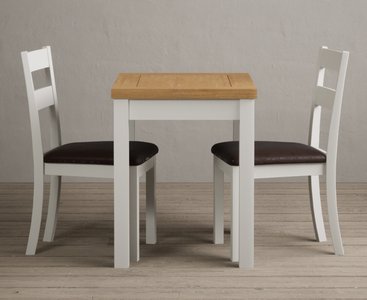 View Extending hadleigh oak and signal white painted dining table with 2 brown kendal chairs View Extending hadleigh oak and signal white painted dining table with 2 brown kendal chairs