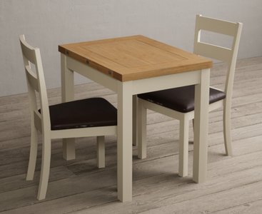 View Extending hadleigh oak and cream painted dining table with 2 brown kendal chairs View Extending hadleigh oak and cream painted dining table with 2 brown kendal chairs