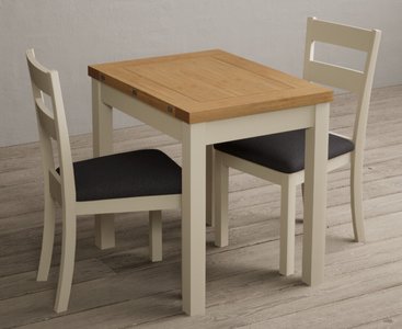 View Extending hadleigh oak and cream painted dining table with 2 charcoal grey kendal chairs View Extending hadleigh oak and cream painted dining table with 2 charcoal grey kendal chairs