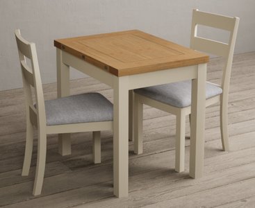 View Extending hadleigh oak and cream painted dining table with 2 light grey kendal chairs View Extending hadleigh oak and cream painted dining table with 2 light grey kendal chairs