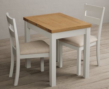 View Extending hadleigh oak and signal white painted dining table with 2 linen kendal chairs View Extending hadleigh oak and signal white painted dining table with 2 linen kendal chairs