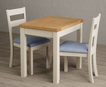 View Extending hadleigh oak and cream painted dining table with 2 blue kendal chairs View Extending hadleigh oak and cream painted dining table with 2 blue kendal chairs