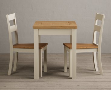 View Extending hadleigh oak and cream painted dining table with 2 oak kendal chairs View Extending hadleigh oak and cream painted dining table with 2 oak kendal chairs