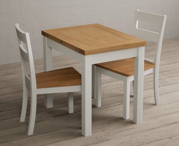 View Extending hadleigh oak and signal white painted dining table with 2 oak kendal chairs View Extending hadleigh oak and signal white painted dining table with 2 oak kendal chairs