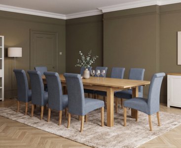 View Extending buxton 140cm solid oak dining table with 10 blue scroll back chairs View Extending buxton 140cm solid oak dining table with 10 blue scroll back chairs