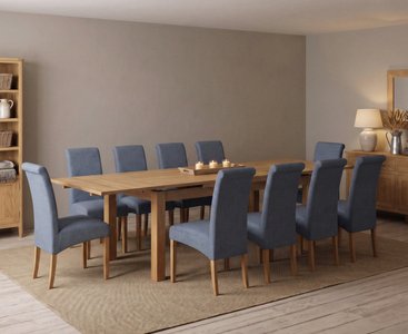 View Extending buxton 180cm solid oak dining table with 10 blue scroll back chairs View Extending buxton 180cm solid oak dining table with 10 blue scroll back chairs