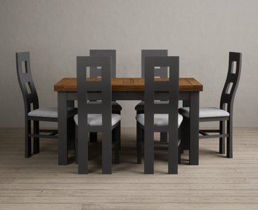 View Extending buxton 140cm oak and charcoal grey dining table with 6 light grey painted chairs View Extending buxton 140cm oak and charcoal grey dining table with 6 light grey painted chairs