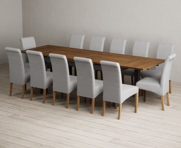 View Extending buxton 180cm oak and charcoal grey dining table with 12 grey scroll back chairs View Extending buxton 180cm oak and charcoal grey dining table with 12 grey scroll back chairs
