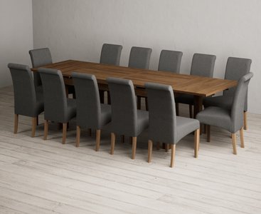 View Extending buxton 180cm rustic solid oak dining table with 12 charcoal grey scroll back chairs View Extending buxton 180cm rustic solid oak dining table with 12 charcoal grey scroll back chairs