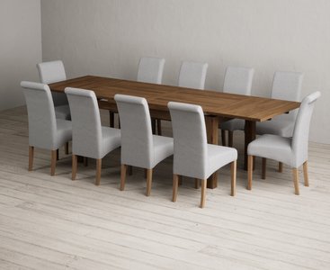 View Extending buxton 180cm rustic solid oak dining table with 10 grey scroll back chairs View Extending buxton 180cm rustic solid oak dining table with 10 grey scroll back chairs