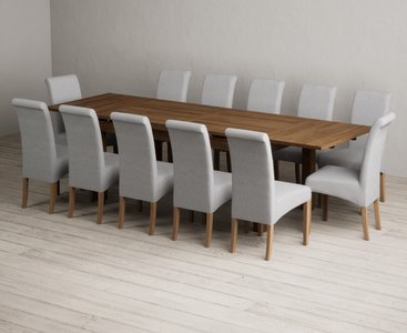 View Extending buxton 180cm rustic solid oak dining table with 12 grey scroll back chairs View Extending buxton 180cm rustic solid oak dining table with 12 grey scroll back chairs