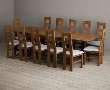 Photo of extending buxton 180cm rustic solid oak dining table with 12 light grey rustic solid oak chairs