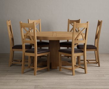 View Helmsley 150cm solid oak round pedestal dining table with 6 brown natural solid oak chairs View Helmsley 150cm solid oak round pedestal dining table with 6 brown natural solid oak chairs