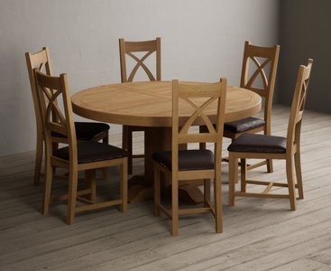 View Helmsley 150cm solid oak round pedestal dining table with 8 brown natural solid oak chairs View Helmsley 150cm solid oak round pedestal dining table with 8 brown natural solid oak chairs
