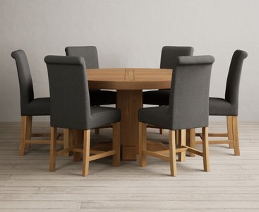 View Helmsley 150cm solid oak round pedestal dining table with 6 charcoal grey braced chairs View Helmsley 150cm solid oak round pedestal dining table with 6 charcoal grey braced chairs