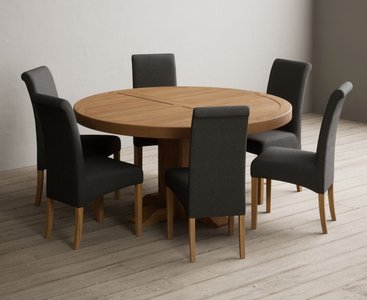 View Helmsley 150cm solid oak round pedestal dining table with 8 charcoal grey scroll back chairs View Helmsley 150cm solid oak round pedestal dining table with 8 charcoal grey scroll back chairs