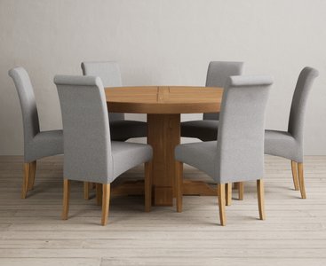 View Helmsley 150cm solid oak round pedestal dining table with 6 grey scroll back chairs View Helmsley 150cm solid oak round pedestal dining table with 6 grey scroll back chairs