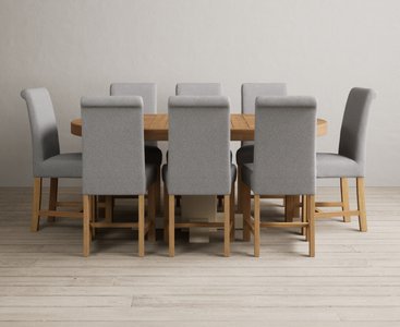 View Extending helmsley oak and cream painted pedestal dining table with 8 grey braced chairs View Extending helmsley oak and cream painted pedestal dining table with 8 grey braced chairs