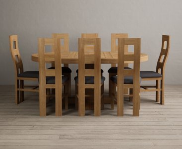 Photo of extending helmsley solid oak pedestal dining table with 8 charcoal grey natural chairs