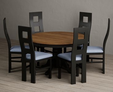 View Hertford 120cm fixed top oak and black painted round pedestal table with 6 blue painted chairs View Hertford 120cm fixed top oak and black painted round pedestal table with 6 blue painted chairs