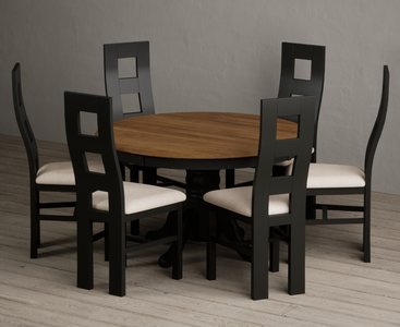 View Hertford 120cm fixed top oak and black painted round pedestal table with 6 linen painted chairs View Hertford 120cm fixed top oak and black painted round pedestal table with 6 linen painted chairs