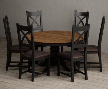 View Hertford 120cm fixed top oak and black painted round pedestal table with 6 brown painted chairs View Hertford 120cm fixed top oak and black painted round pedestal table with 6 brown painted chairs