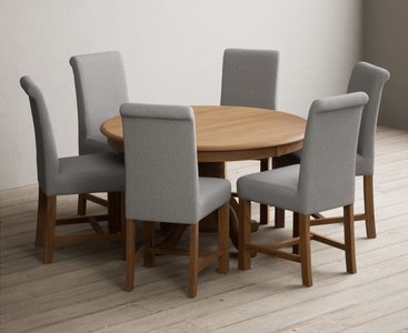 View Hertford 120cm fixed top solid oak round pedestal table with 6 grey braced chairs View Hertford 120cm fixed top solid oak round pedestal table with 6 grey braced chairs