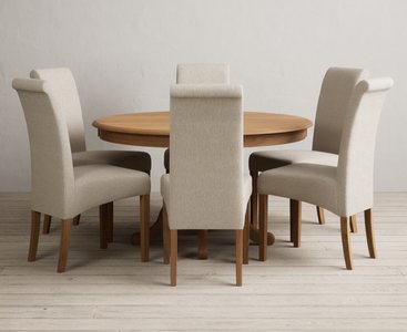 View Hertford 120cm fixed top solid oak round pedestal table with 6 natural scroll back chairs View Hertford 120cm fixed top solid oak round pedestal table with 6 natural scroll back chairs
