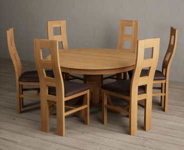 View Hertford 120cm fixed top solid oak round pedestal table with 6 brown natural chairs View Hertford 120cm fixed top solid oak round pedestal table with 6 brown natural chairs