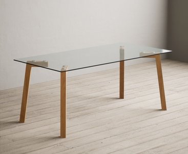 View Lakelyn 180cm solid oak and glass dining table View Lakelyn 180cm solid oak and glass dining table