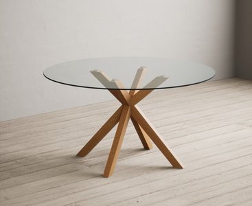 View Lakelyn 140cm round solid oak and glass dining table View Lakelyn 140cm round solid oak and glass dining table