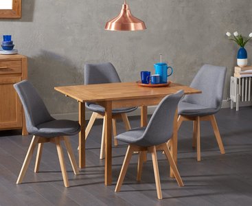 Photo of extending york 70cm solid oak drop leaf dining table with 4 light grey orson chairs