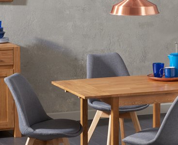 View Extending york 70cm solid oak dining table with 2 dark grey orson chairs View Extending york 70cm solid oak dining table with 2 dark grey orson chairs