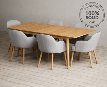 Photo of extending ruben 200cm retro oak dining table with 8 light grey oliver chairs