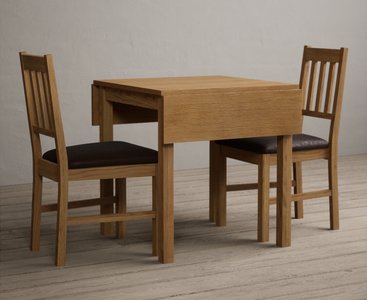 Photo of extending york 70cm solid oak dining table with 2 brown york chairs