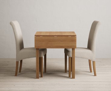 View Extending york 70cm solid oak dining table with 2 natural scroll back chairs View Extending york 70cm solid oak dining table with 2 natural scroll back chairs