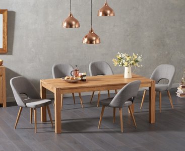 View Thetford 150cm oak dining table with 6 grey chairs View Thetford 150cm oak dining table with 6 grey chairs