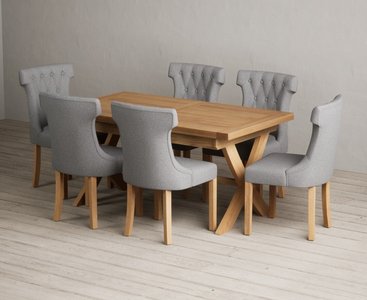 View Extending buckley 160cm solid oak dining table with 10 grey clara chairs View Extending buckley 160cm solid oak dining table with 10 grey clara chairs