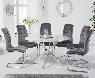 View Comiso 120cm round white marble dining table with 6 grey vigo chairs View Comiso 120cm round white marble dining table with 6 grey vigo chairs